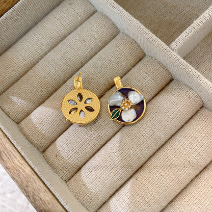 Close-up of Baroque pearl on minimalist vintage earrings.