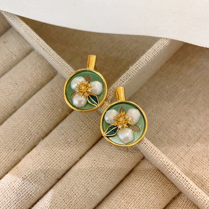 Side view of minimalist vintage earrings showcasing the gold-plated copper finish.