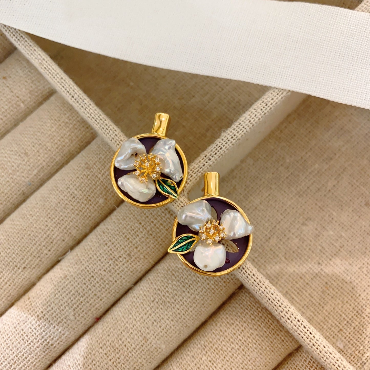 Side view of minimalist vintage earrings showcasing the gold-plated copper finish.