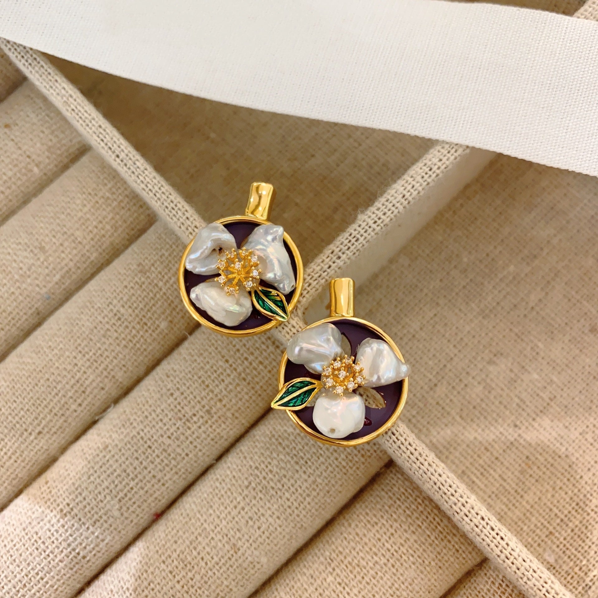 Side view of minimalist vintage earrings showcasing the gold-plated copper finish.